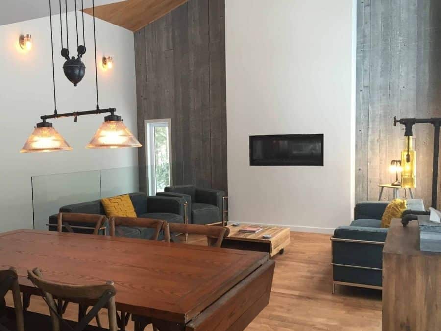 Concrete Look Wallpaper, as seen on the wall of this dining room, is a high res photo mural of gray textured concrete planks from About Murals.