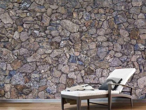 Dry Stone Wallpaper, as seen on the wall of this spa, is a photo mural of a dark brown and blue drystack wall from About Murals.