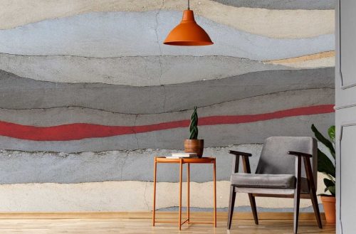 Grey and Red Concrete Wallpaper, as seen on the wall of this foyer, is a photo mural of a vertical painted stripe on a concrete wall from About Murals.