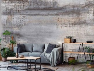 Patina Concrete Effect Wallpaper, as seen on the wall of this living room, is a photo mural of a soft grey and rust colored concrete wall from About Murals.