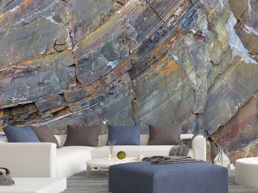 Rock Texture Wallpaper, as seen on the wall of this grey living room, is a photo mural of a colorful rock face cliff wall from About Murals.