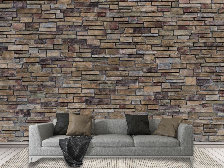 Stacked Stone Wallpaper, as seen on the wall of this grey living room, is a faux stone mural created from a photo of a real grey stone wall from About Murals.
