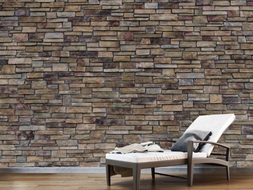 Stacked Stone Wallpaper, as seen on the wall of this spa, is a photo mural of a modern brown stone wall from About Murals.