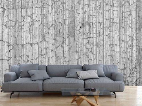 Textured Concrete Wallpaper, as seen on the wall of this living room, is a photo mural of dried out concrete from About Murals.