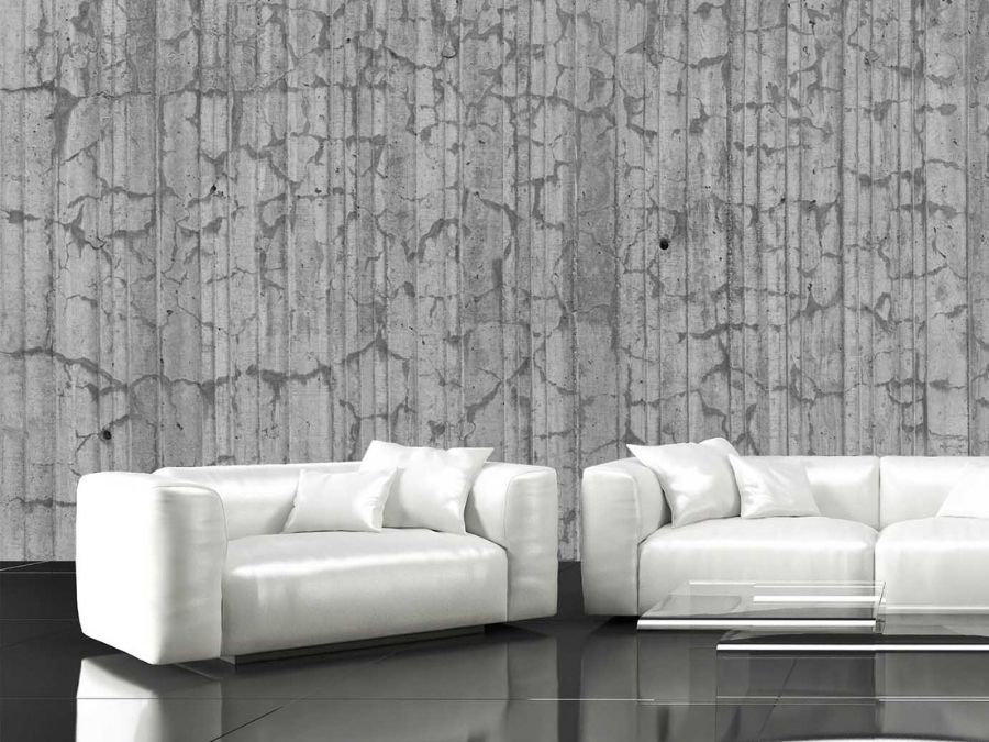 Textured Concrete Wallpaper, as seen on the wall of this white living room, is a photo mural of gray dried out concrete from About Murals.