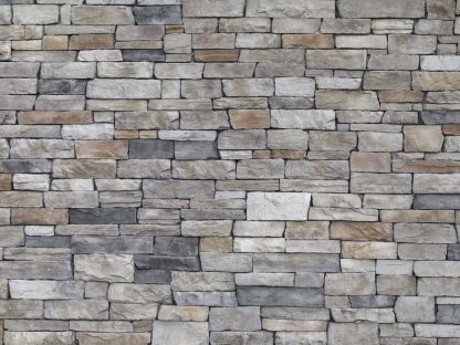 Textured Stone Wallpaper is a photo mural of a dry stack, grey slate stone wall from About Murals.
