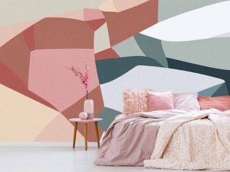Abstract Shape Wallpaper, as seen on the wall of this bedroom, is a pink and blue geometric mural of the sea meeting cliffs from About Murals.