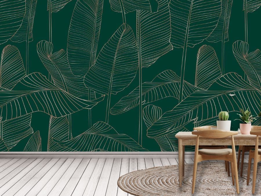 Banana Leaf Wallpaper, as seen on the wall of this kitchen, is a tropical mural with a gold leaf design on a dark green background from About Murals.