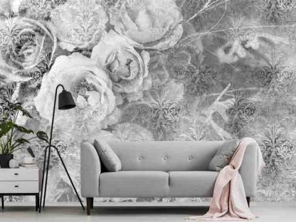Black and White Rose Wallpaper, as seen on the wall of this living room, is a floral mural with large grey flowers and a damask pattern background from About Murals.