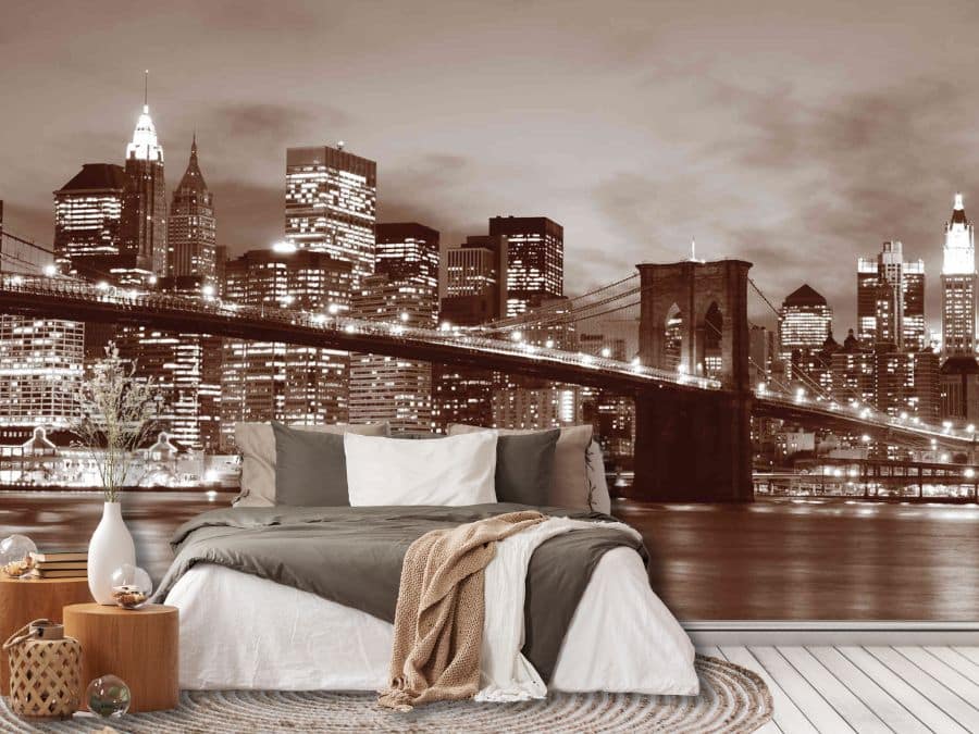 Brooklyn Bridge Park Wallpaper, as seen on the wall of this brown bedroom, is a photo wall mural of the NYC skyline taken from lower Manhattan at night from About Murals.