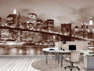 Brooklyn Bridge Park Wallpaper, as seen on the wall of this office, is a photo wall mural with a brown filter of the famous suspension bridge overlooking the East River, skyscrapers and apartments under a night sky in New York City from About Murals.