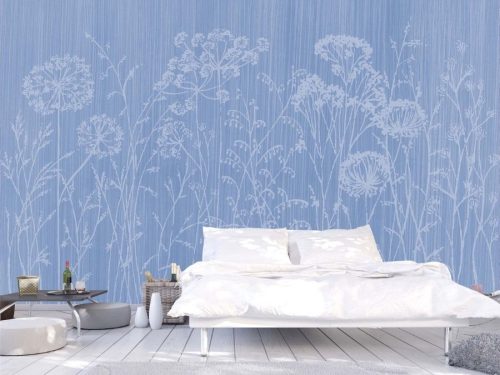 Cow Parsley Wallpaper, as seen on the wall of this bedroom, is a floral mural with silhouettes of country flowers on a blue background from About Murals.