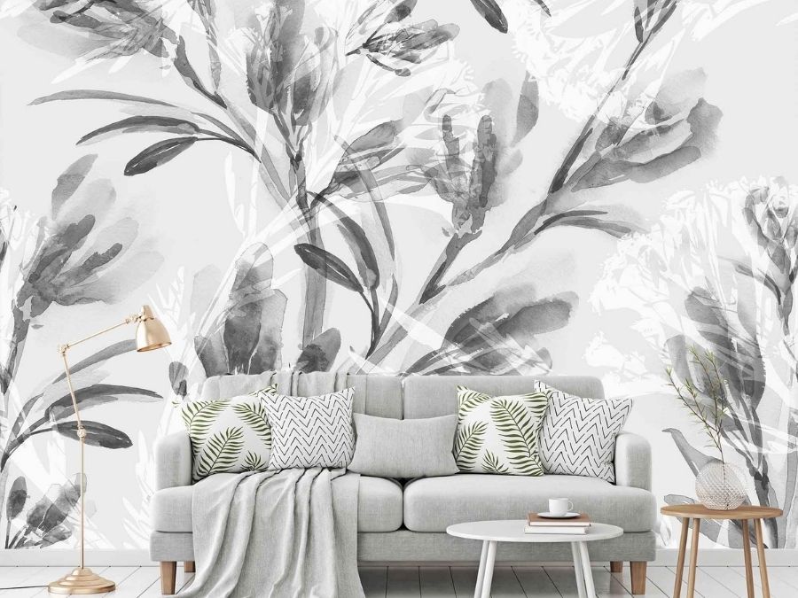 Grey Watercolor Flower Wallpaper, as seen on the wall of this living room, features painted lily flowers from About Murals.