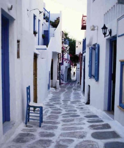 Mykonos Wallpaper is a photo mural featuring a cobblestone alley in Mykonos Greece from About Murals.