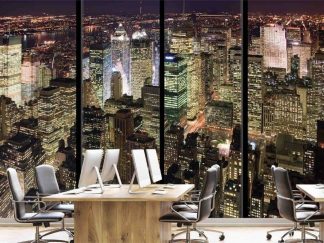 New York Apartment View, as seen on the wall of this office, is a photo mural of windows overlooking Manhattan at night from About Murals.