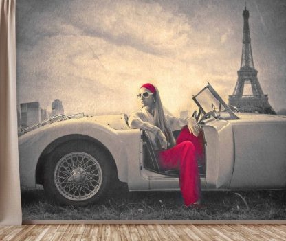 Paris Fashion Wallpaper, as seen on the wall of this living room, is a photo mural of a French model sitting in an Austin Healey car under the Eiffel Tower in France from About Murals.