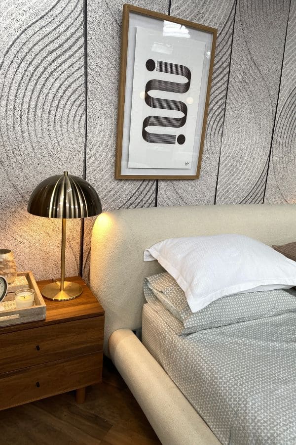 Scandi Leaf Wallpaper, as seen on Cityline's zen bedroom episode by Colin and Justin, is a wall mural with a simple leaf pattern raked into gray sand from About Murals.