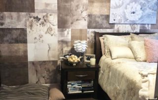 Vintage Patchwork Wallpaper, as seen on the wall of this room, features beige rose flowers in quilt like boxes filled with wood, concrete, fabric and geometric pattern textures from About Murals.