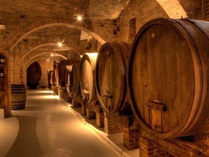 Barrel Wallpaper is a photo wall mural of oak barrels in a wine cellar in Tuscany, Italy from About Murals.