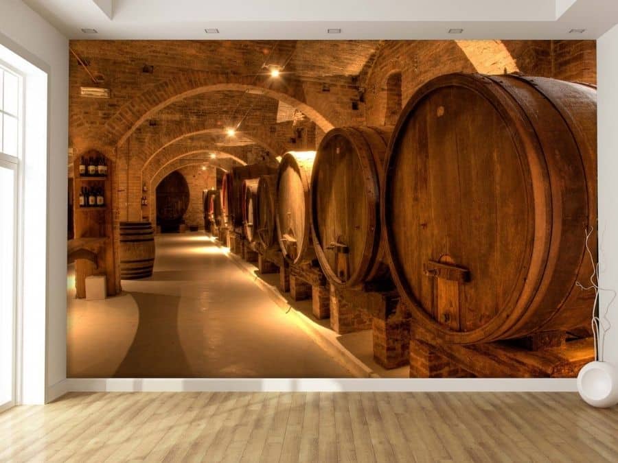Barrel Wallpaper, as seen on the wall of this hallway, is a photo mural of large wine barrels in a brick cellar from About Murals.