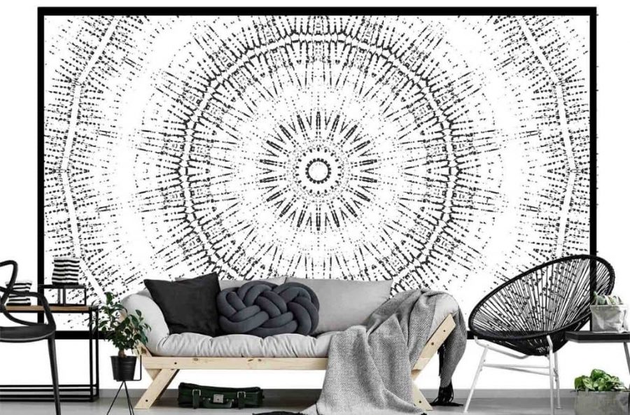 Circle Wallpaper, as seen on the wall of this living room, is a spiritual mural in a black and white mandala design from About Murals.