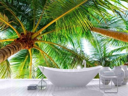 Coconut Tree Wallpaper, as seen on the wall of this beach themed room, is a photo mural of a palm tree canopy from below sold by About Murals.