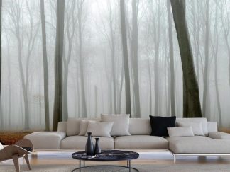 Gray Fall Wallpaper, as seen on the wall of this living room, is a photo mural of autumn trees in grey fog contrasted against orange leaves on the forest floor from About Murals.