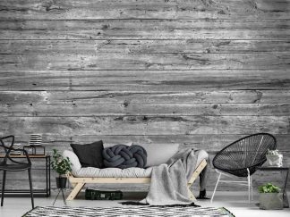 Grey Wood Wallpaper, as seen on the wall of this grey rustic living room, is a realistic photo mural of horizontal barn wood planks full of textured knots and grain from About Murals.