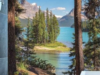 Jasper Wallpaper, as seen on the wall of this bathroom, is a photo mural of pine trees on Spirit Island with the Canadian Rocky Mountains behind Maligne Lake from About Murals.