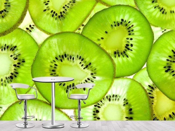 Kiwi Wallpaper, as seen on the wall of this restaurant dining room, is a photo mural of large green fruit slices from About Murals.