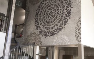 Mandala Wallpaper, as seen on the wall of this kitchen, is a spiritual mural with geometric circle patterns in grey from About Murals.