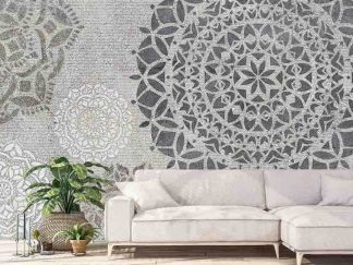 Mandala Wallpaper, as seen on the wall of this zen living room, is a mural with grey, beige and white geometric circles with flower centers on a textured background from About Murals.
