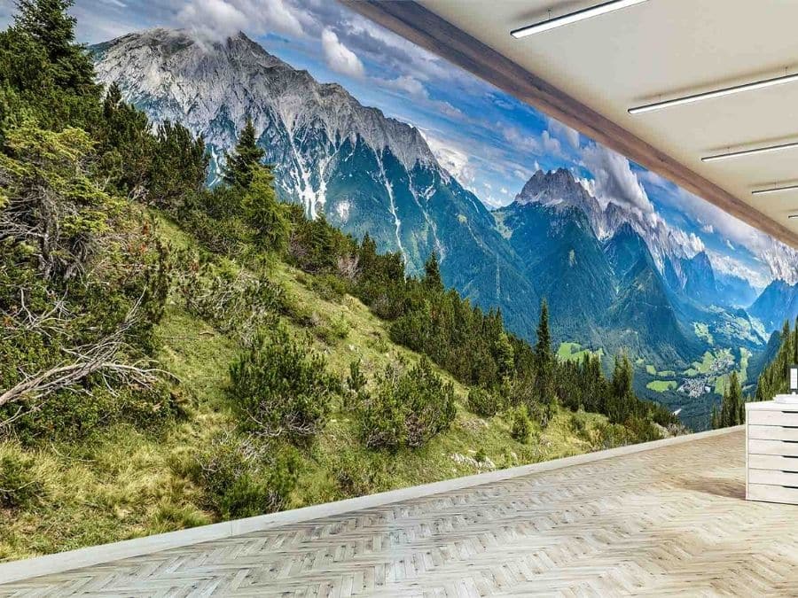 Mountain Forest Wallpaper, as seen on the wall of this office, is a photo mural of the Austrian Alps near Innsbruck from About Murals.