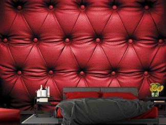 Red Leather Wallpaper, as seen on the wall of this bedroom, is a mural with tufted leather from About Murals.