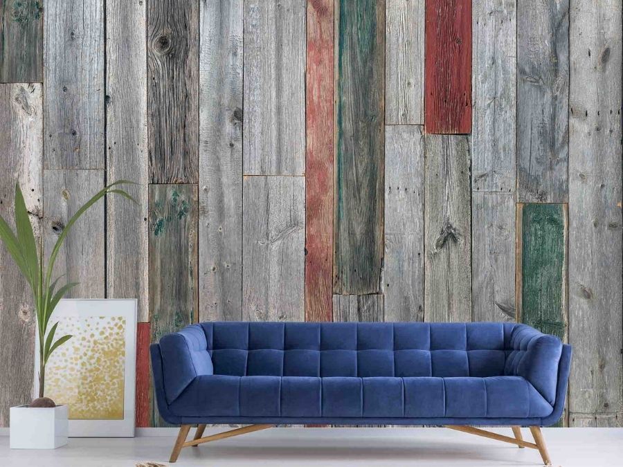 Rustic Wood Wallpaper, as seen on the wall of this living room, is a photo mural of red, green and gray barn wood from About Murals.