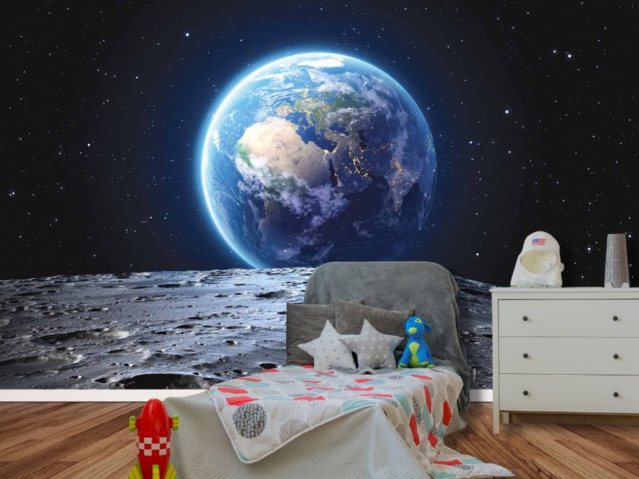 Space Earth Wallpaper, as seen on the wall of this children’s bedroom, is a mural with cool views of planet earth as seen from the moon, surrounded by a black star-studded galaxy from About Murals.