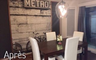 Bicycle Wallpaper, as seen on the wall of this dining room, is a black and white photo mural of two bikes leaning against a brick wall under a Paris Subway Metro sign from About Murals.