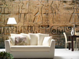 Hieroglyph Wallpaper, as seen on the wall of this Egyptian themed living room, is a photo mural of sacred carvings at Karnak Temple in Egypt from About Murals.