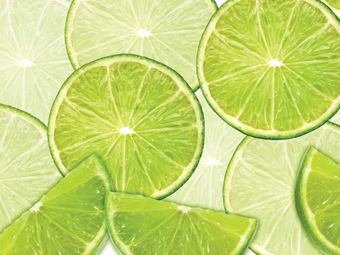 Lime Wallpaper is a food mural of large citrus slices from About Murals.