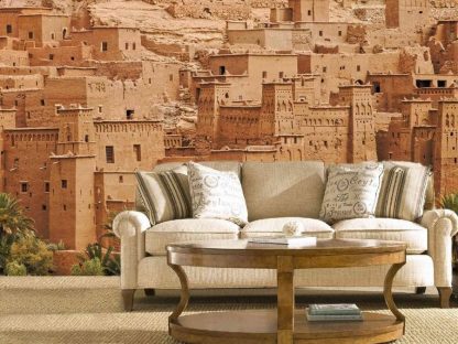Morocco Wallpaper, as seen on the wall of this living room, is a mural of the Ksar of Ait Ben Haddou in Morocco from About Murals.