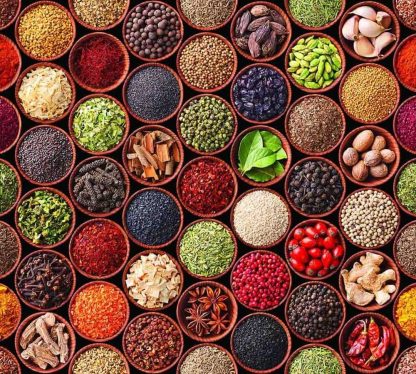Spice Wallpaper is a photo mural taken from above of Indian masala type spices in small brown bowls from About Murals.