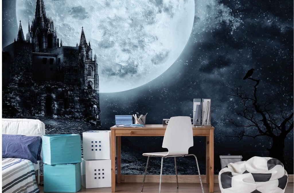 Dark Castle Wallpaper, as seen on the wall of this bedroom, is a mural of a black gothic castle backlit by a full moon under a starry night sky from About Murals.