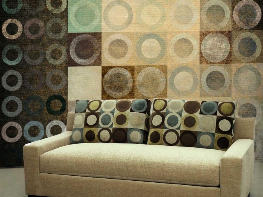 Retro Circle Wallpaper, as seen on the wall of this living room, is a mural with brown circles in squares from About Murals.