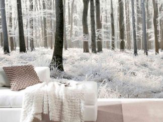 White Forest Wallpaper, as seen on the wall of this modern living room, is a photo mural of snowy trees in winter woods from About Murals.