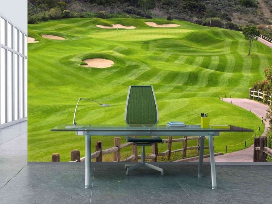 Golf Green Wallpaper, as seen on the wall of this office, is a photo mural of a fairway and bunker surrounding a golf green from About Murals.