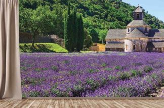 Lavender Field Wallpaper, as seen on the wall in this yoga studio, is a photo mural of Senanque Abbey overlooking a purple lavender field near Gordes, Provence from About Murals.
