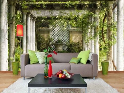 Garden Column Wallpaper, as seen on the wall of this living room, is a photo mural of green vines on a white pergola from About Murals.