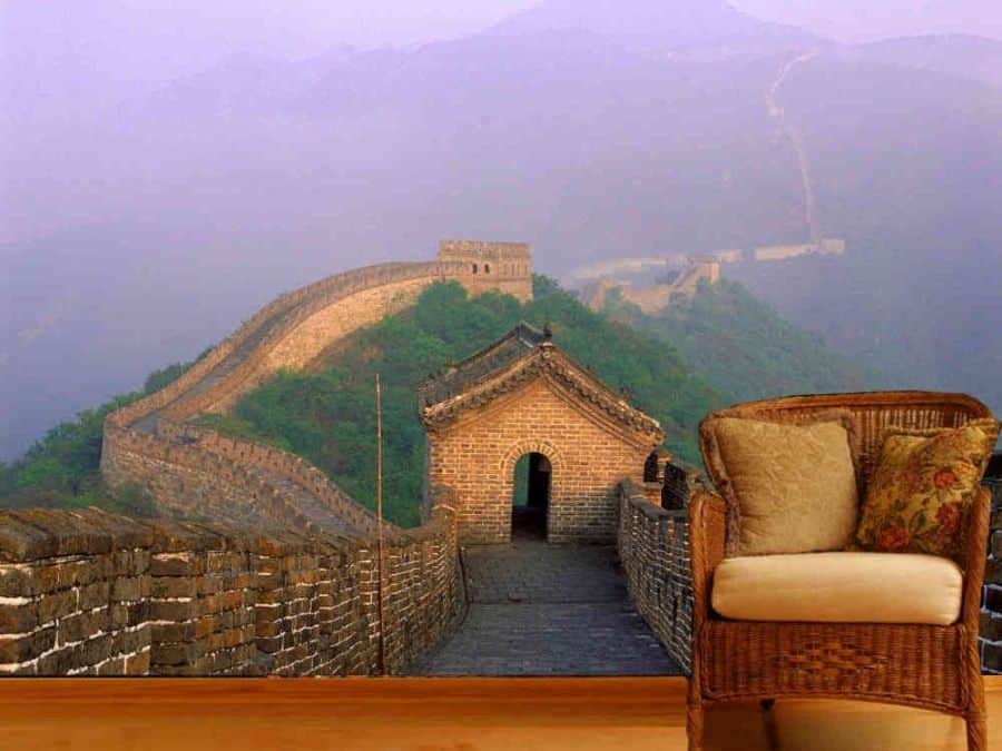 Great Wall of China Wallpaper, as seen on the wall of this living room, is a photo mural of the ancient fortification spanning across misty mountains from About Murals.