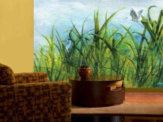 Heron Wallpaper, as seen on the wall of this living room, is a mural with two great blue herons in wetland green reeds from About Murals.