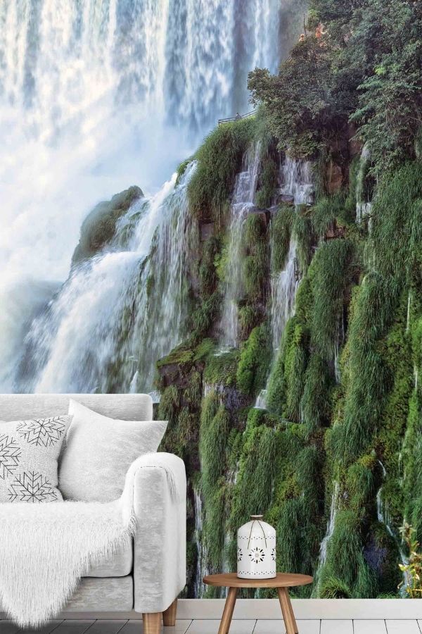 Iguazu Falls Wallpaper, as seen on the wall of this living room, is a photo mural of white water gushing over moss covered rock in Argentina from About Murals.